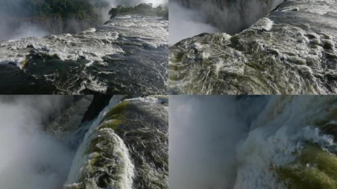 壮观的空中超特写镜头飞越风景秀丽的维多利亚瀑布边缘涌出的水面。联合国教科文组织世界遗产