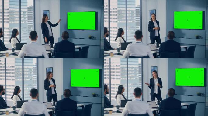 办公室会议室会议演示: 年轻积极进取的高加索女商人演讲，使用绿屏色度键墙电视。成功向多民族投资者群体