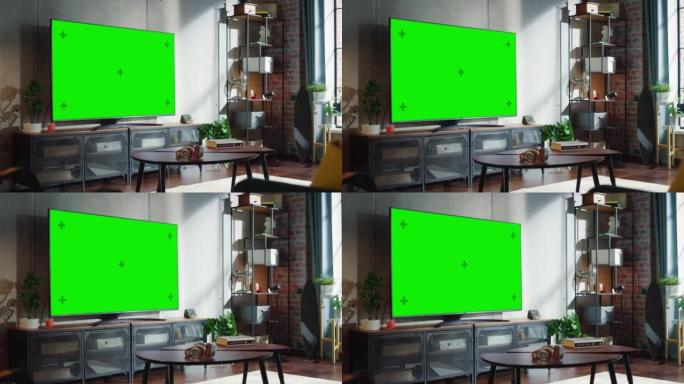 简单阁楼客厅现代控制台上的绿色大屏幕电视。房间中间有绿色色度键电视。放大相机拍摄