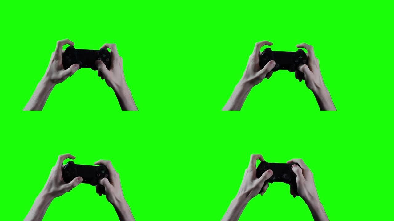 男性手握着操纵杆在绿色屏幕上。