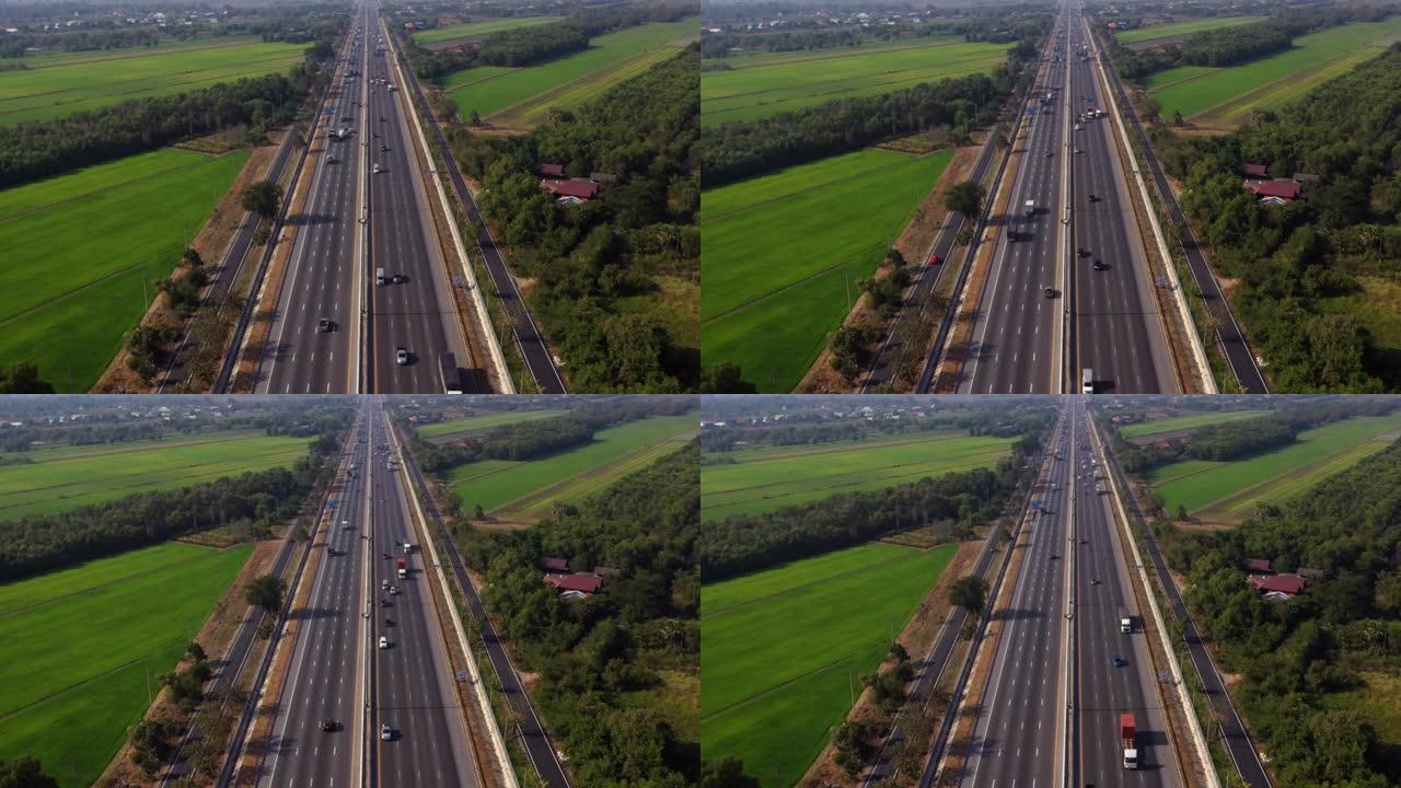 高峰时段的鸟瞰图，包括汽车和卡车的公路运输。无人机: 空中公路旅行概念。