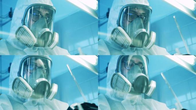 穿着防护服的实验室专家拍穿了橱柜的玻璃