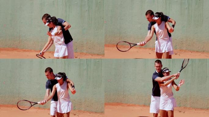 网球教练在红土场上教年轻女子网球