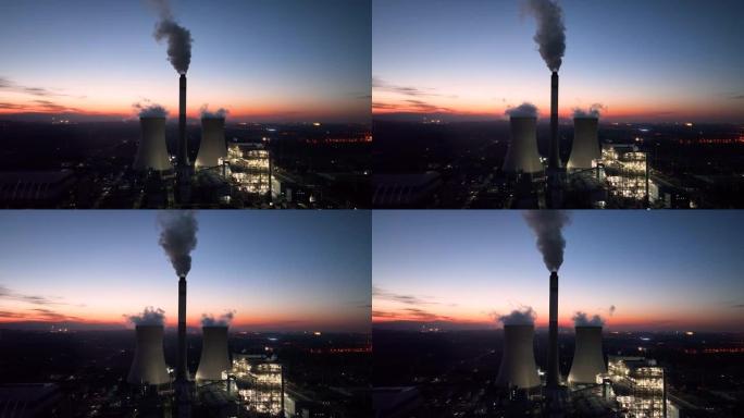 夜间电站鸟瞰图日落烟囱火烧云环境污染