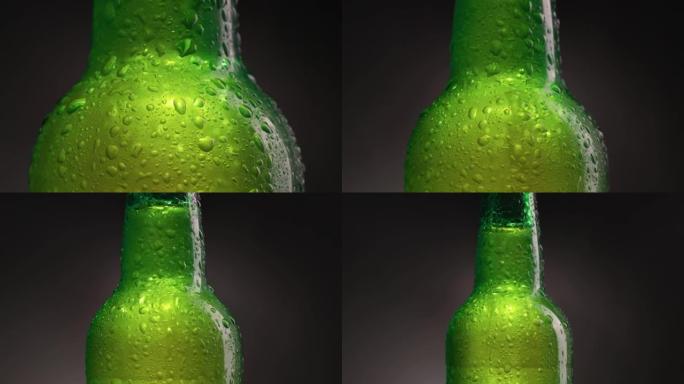 绿色冷瓶，配有啤酒、水或软饮料。装有水滴和冷凝水的瓶子。冷光精酿啤酒。旋转缩小镜头