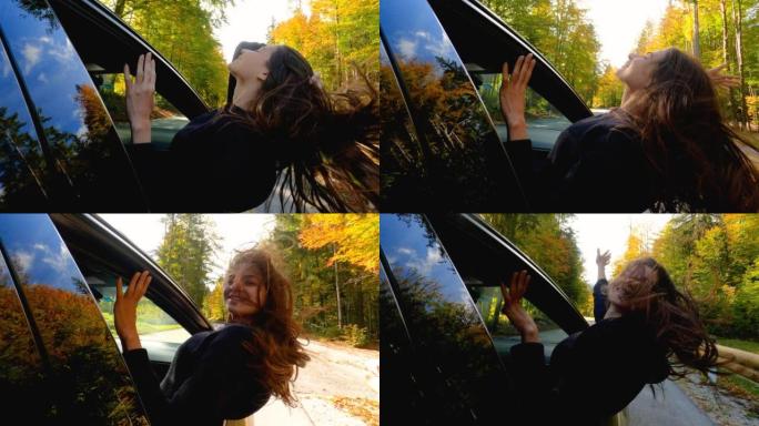 女人喜欢乘车，在穿越秋天的森林时从车窗外倾斜