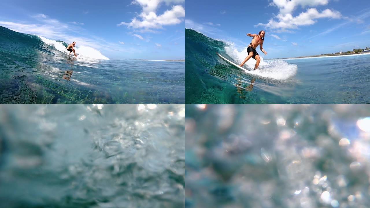 特写: 酷炫的冲浪者花花公子骑着清澈的海浪到达热带岛屿