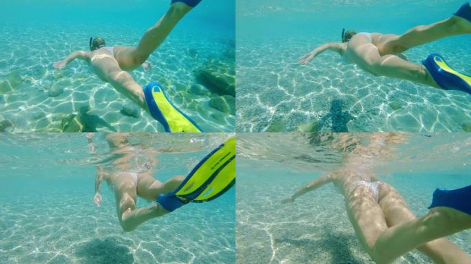 女士年轻女子在克罗地亚阳光明媚的亚得里亚海水下浮潜
