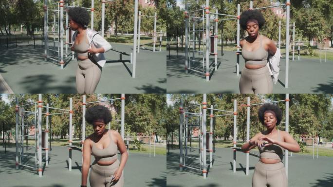 加大码黑人妇女在户外训练中热身
