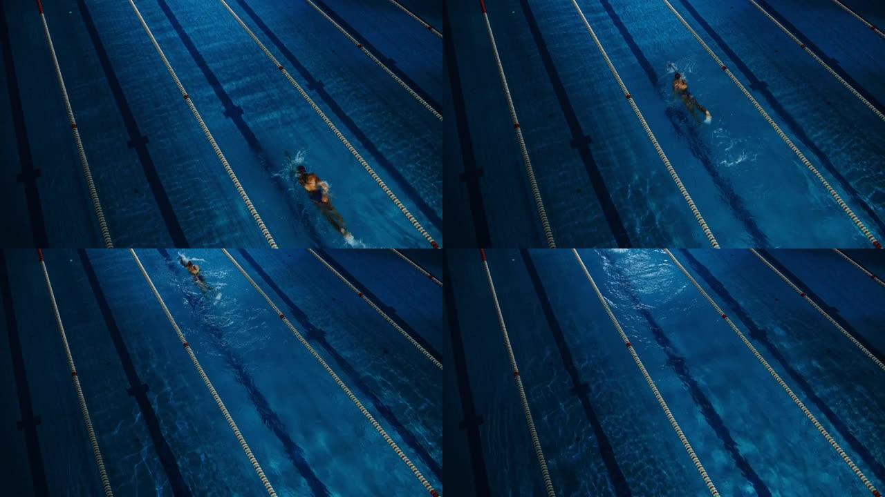 女子游泳运动员在游泳池里比赛。职业运动员决心用蝶式赢得冠军。深色戏剧性的颜色，电影圈车道灯。空中静力