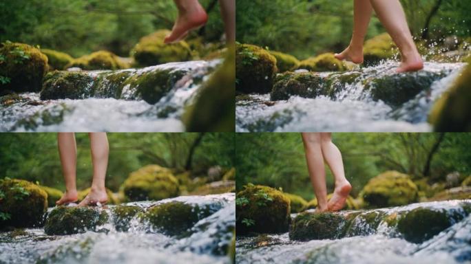 SLO MO年轻女子赤脚穿越溪流