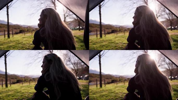 4k视频片段，一名年轻女子坐在帐篷里