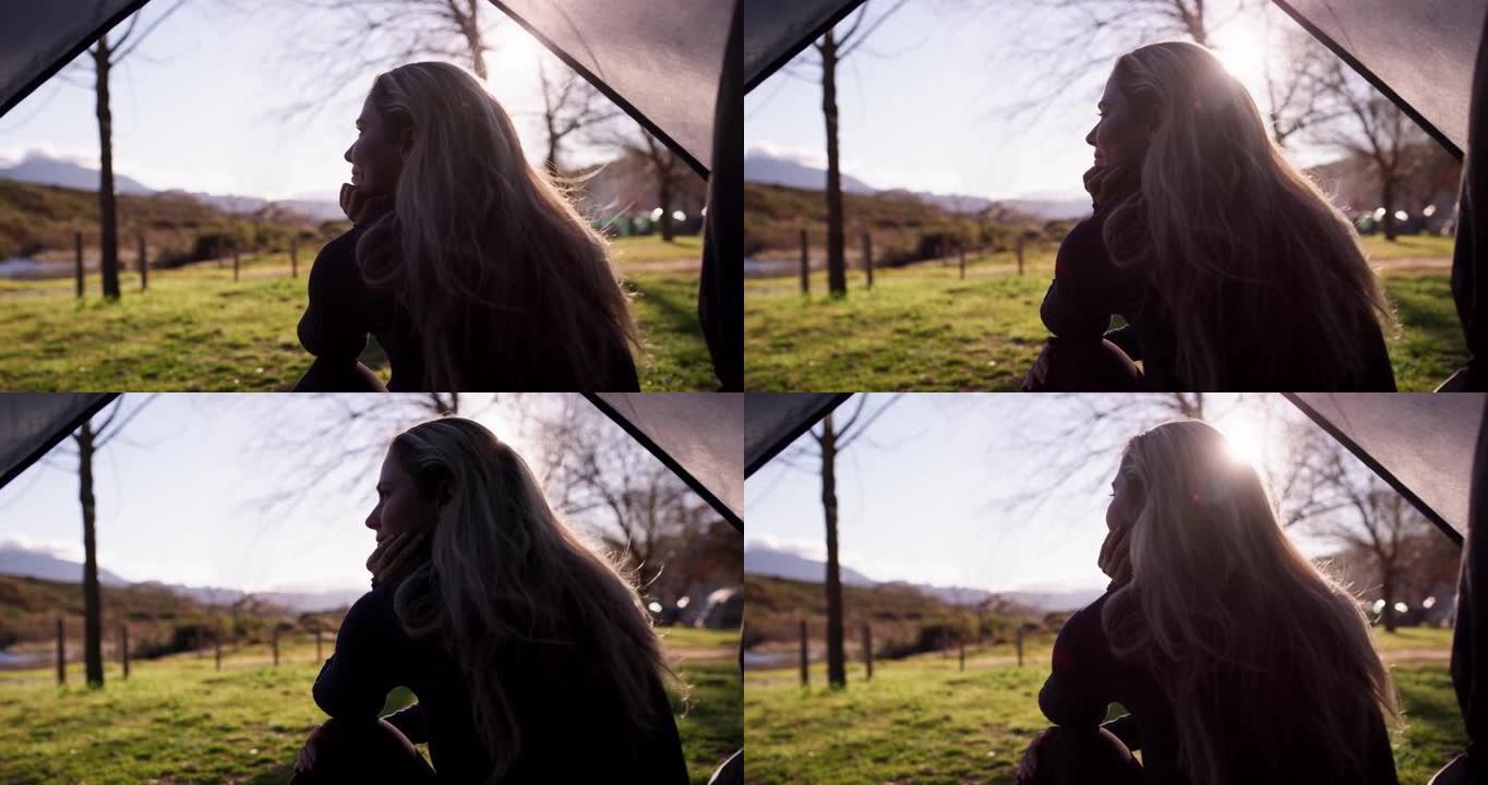 4k视频片段，一名年轻女子坐在帐篷里