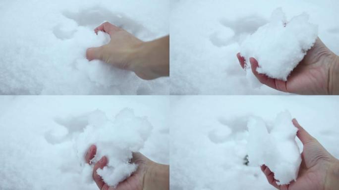 冬天用手抓雪寒冷雪球