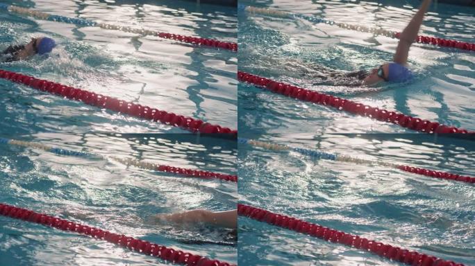 女子游泳运动员练习仰泳的Slowmo