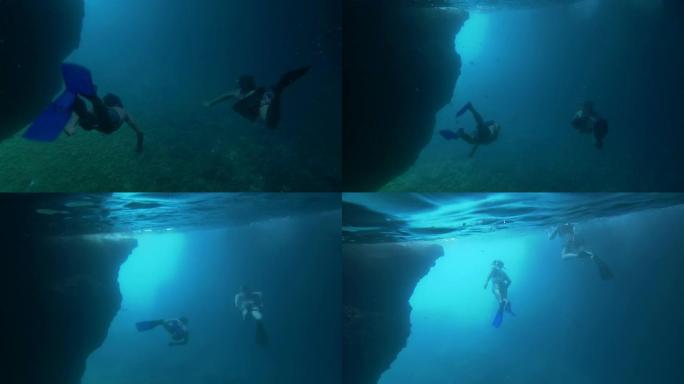 水下: 潜水员在洞穴中游泳