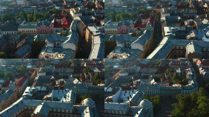 夏季日出时，无人机在乌克兰利沃夫的欧洲老城和平的街道和历史建筑上方飞行。