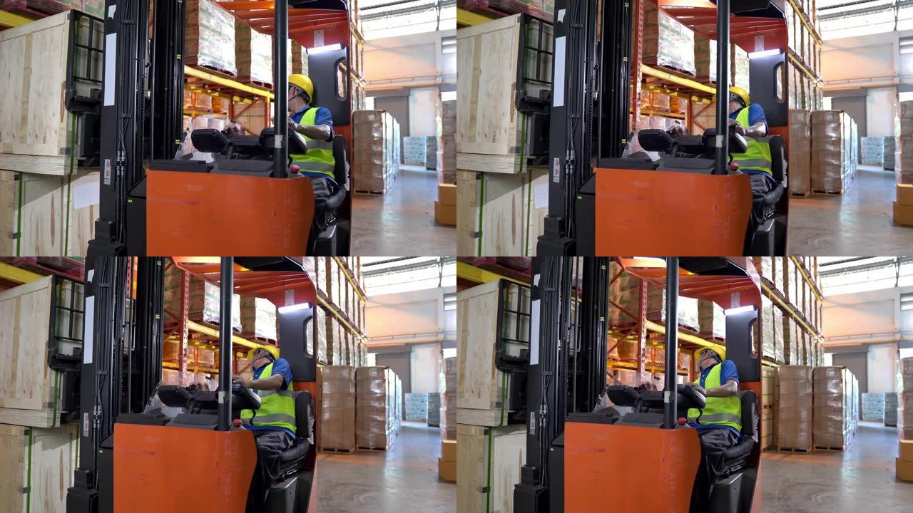 特写多莉镜头: 男性叉车操作员司机在仓库里拿托盘。仓储货物行业概念。