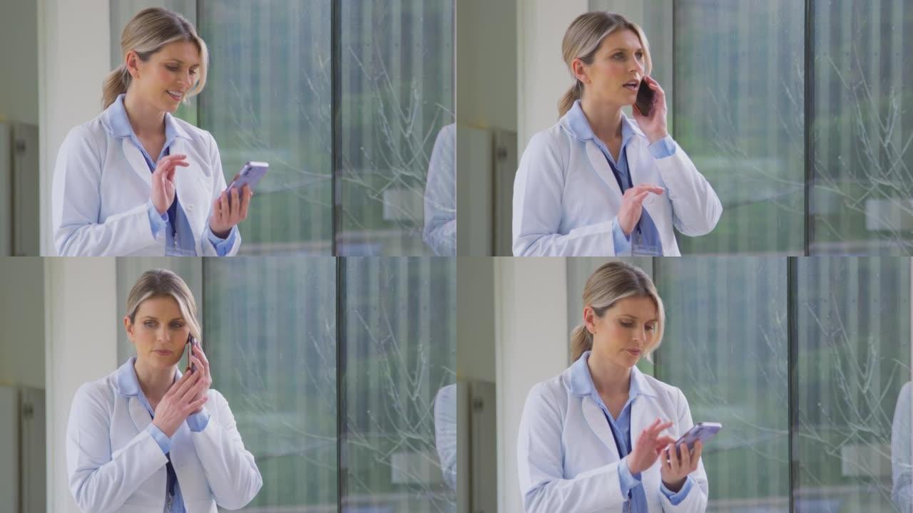 穿着白大褂站在医院走廊上的女医生在手机上聊天-慢动作拍摄