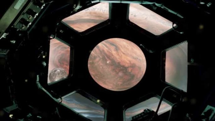 通过航天器的窗户可以看到木星的大红斑。NASA提供的这段视频的元素。4k分辨率。