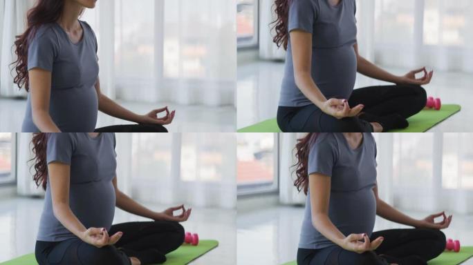 孕妇在家练习瑜伽待产外国人老外女士