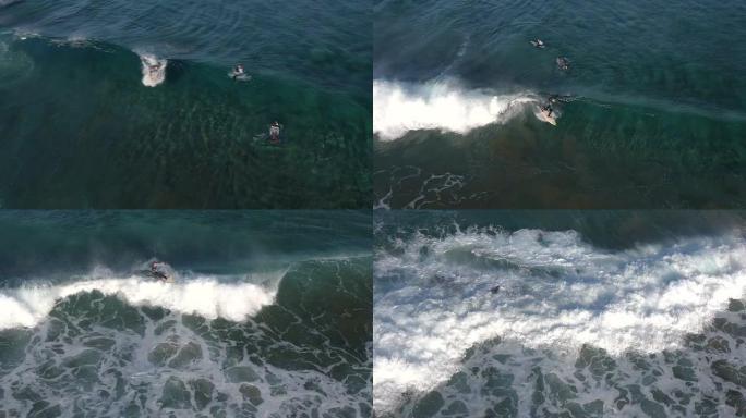 空中: 冲浪者骑着大浪