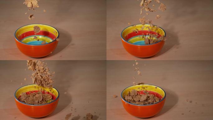 特写: 健康的全麦早餐谷物薄片掉入一个空碗中