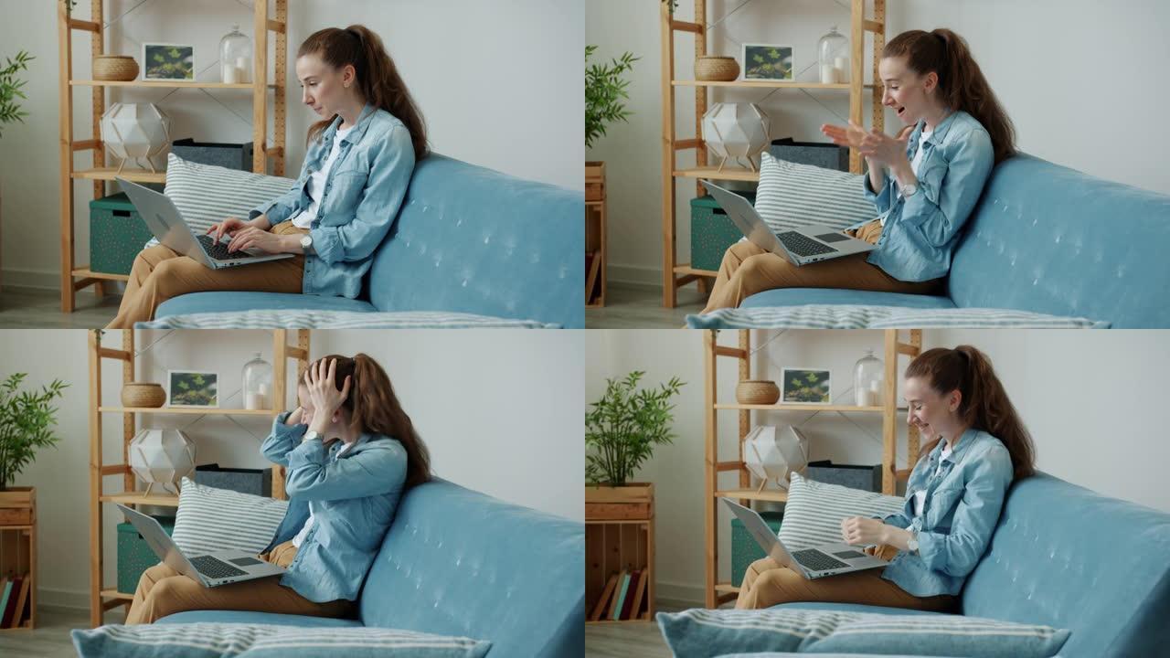 兴奋的年轻女士表现出竖起大拇指的手势，表达积极的情绪看着家里的笔记本电脑屏幕