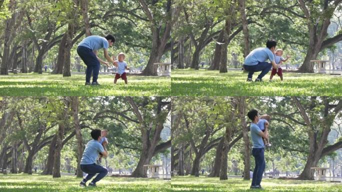 SLO MO男婴与父亲在公园玩耍
