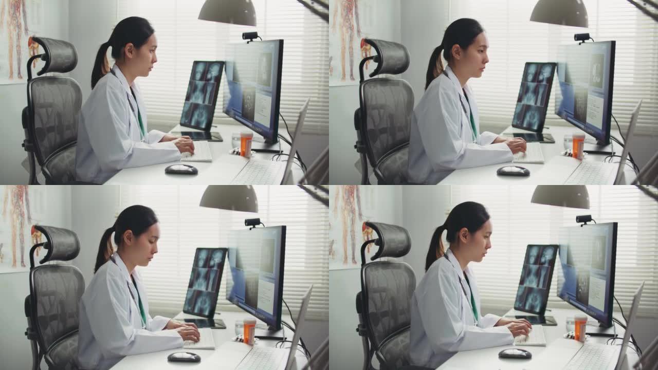 医生在医院的办公桌上使用计算机，医疗保健和医学概念