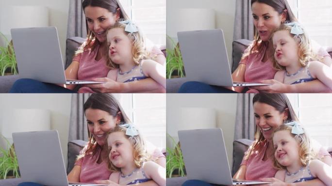 高加索母女使用笔记本电脑玩得开心