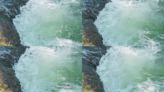 SLO MO水通过石头在河中流动