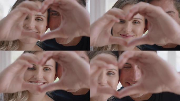 快乐的情侣在情人节4k镜头用手示意浪漫的承诺享受爱情关系