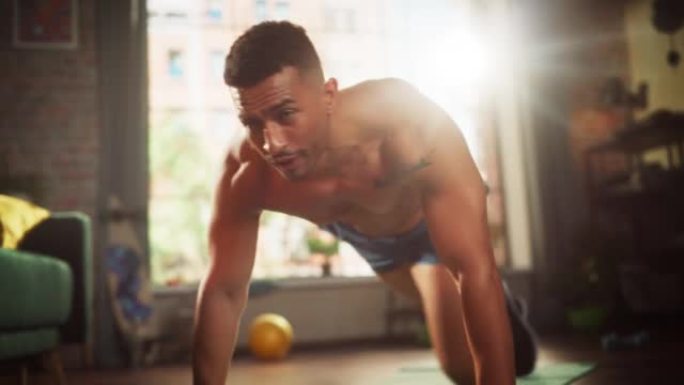 强壮的运动黑人在家庭健身房赤膊锻炼，做登山者锻炼。健康的肌肉运动员保持健康，在家训练。精力充沛、身临