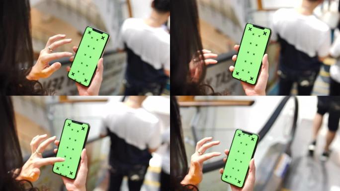 使用智能手机绿屏的女人