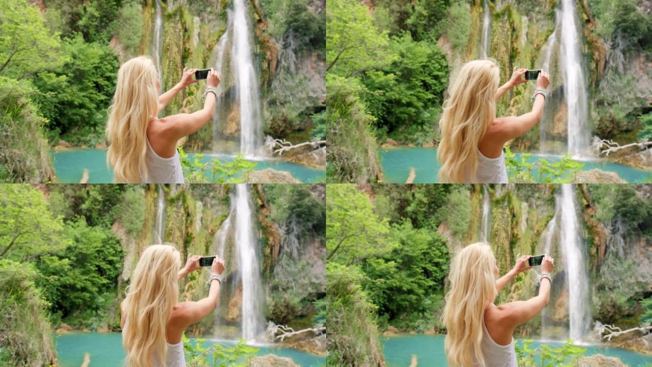 一名妇女拍摄喷泉照片的4k视频片段