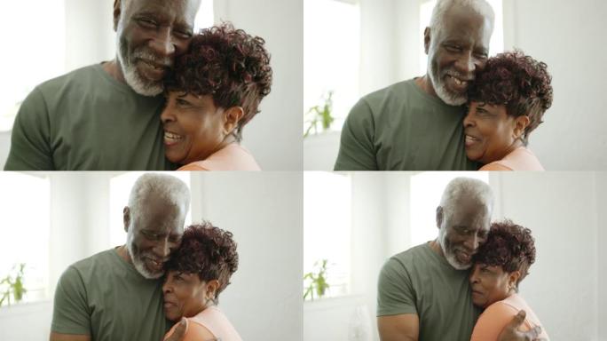 微笑的黑人老人在家中拥抱的头像
