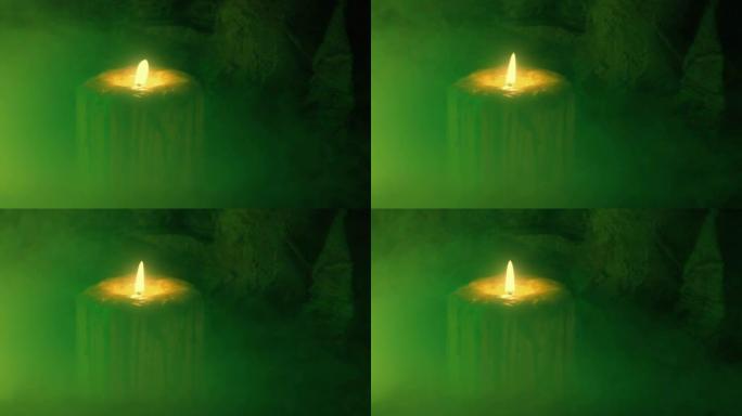 蜡烛在幽灵般的绿色薄雾中吹散