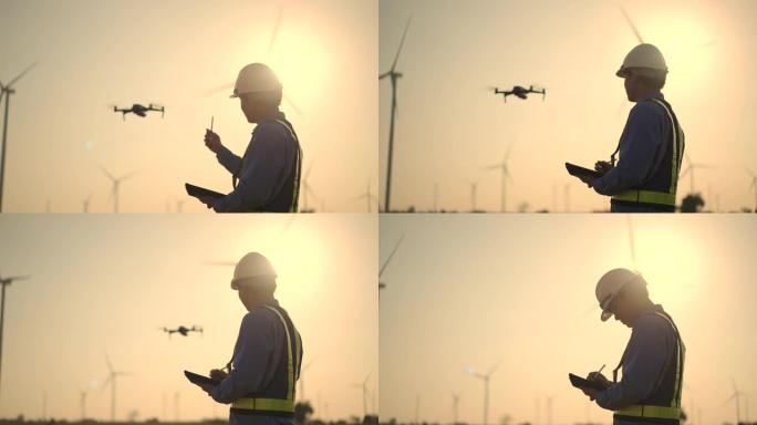 亚洲团队工程师在土木工程项目上操纵无人机飞行