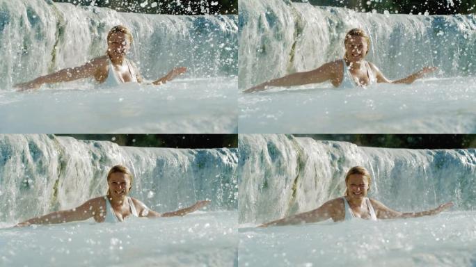 超级SLO MO女人在土星温泉用手泼水玩得开心