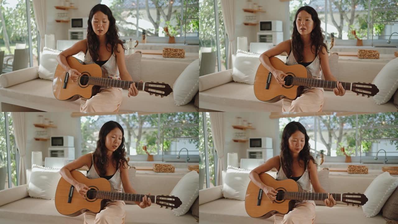 女人在家弹吉他享乐家中安静