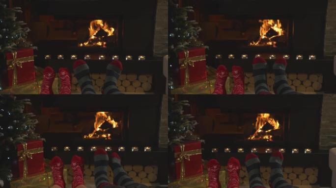 特写: 情侣穿着圣诞袜扭动脚，在壁炉旁热身