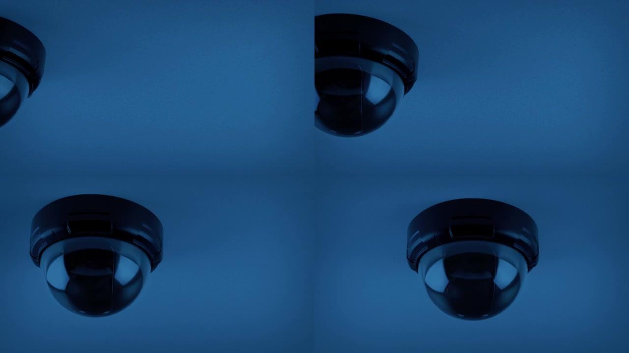 在黑暗的移动镜头中，天花板上的闭路电视圆顶
