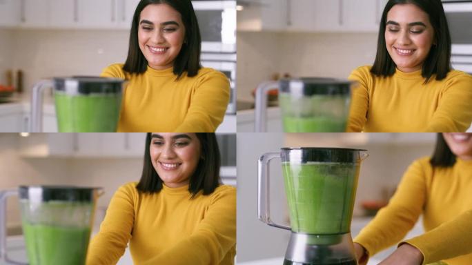4k视频片段，一名年轻女子在家中制作健康的冰沙