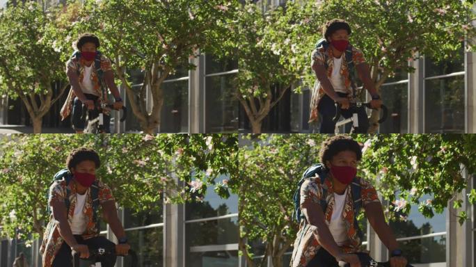 城市中的非裔美国人，戴着口罩在街上骑自行车