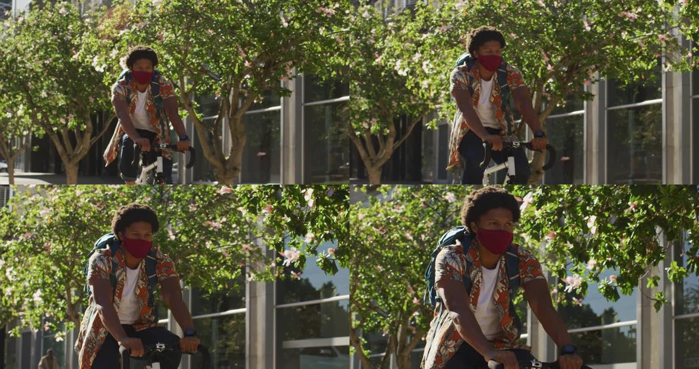 城市中的非裔美国人，戴着口罩在街上骑自行车