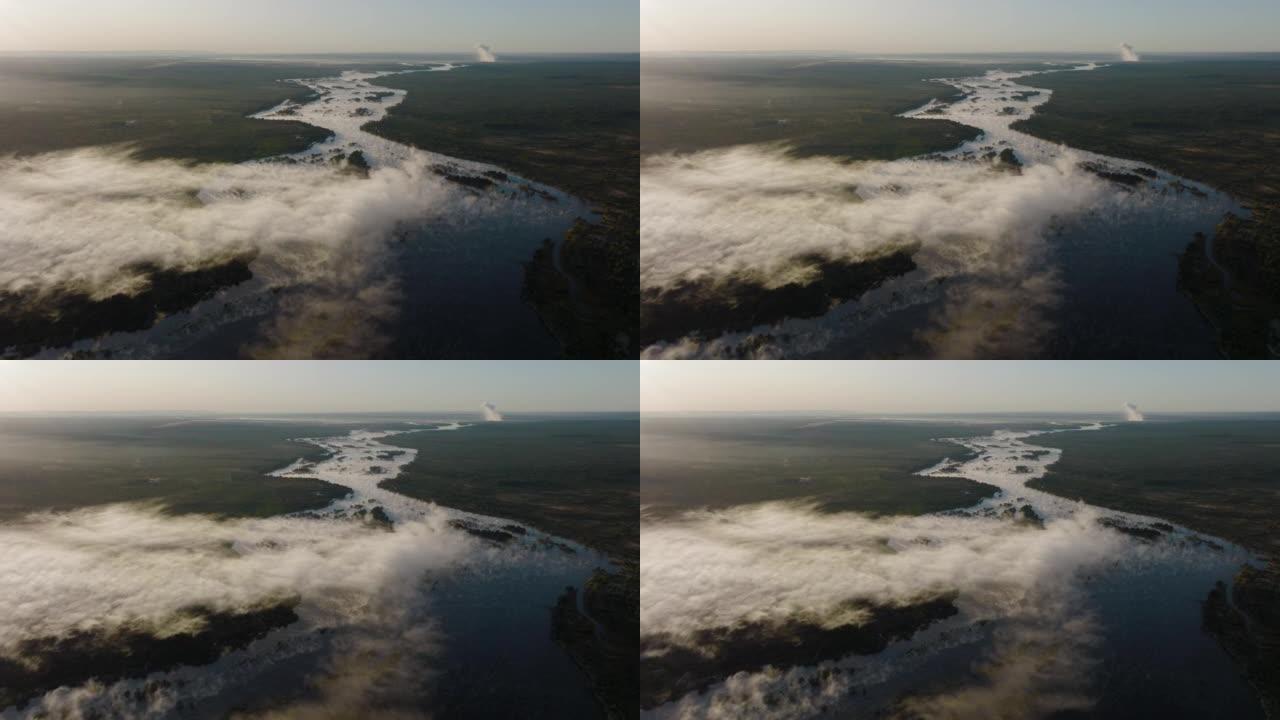 高空中日出，可以看到巨大的赞比西河上的薄雾，流向联合国教科文组织世界遗产维多利亚瀑布