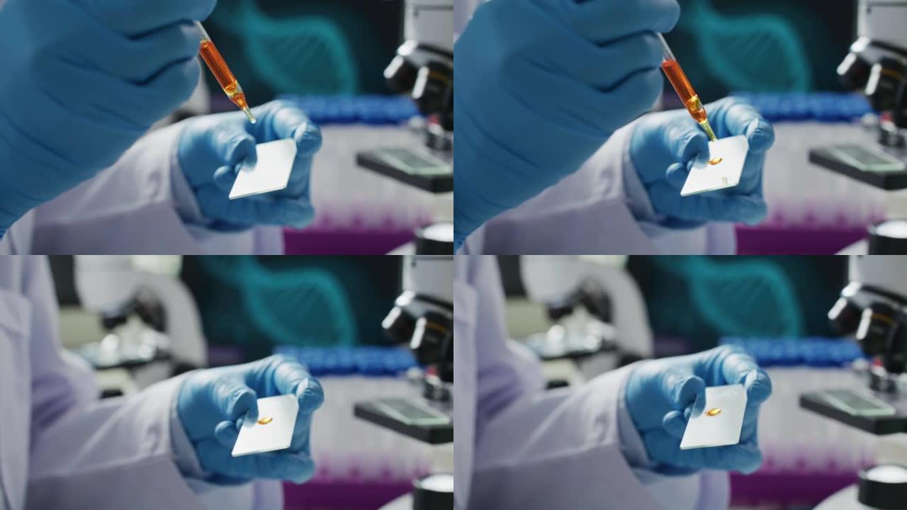 女性医学研究科学家在盘子上添加了有色液体