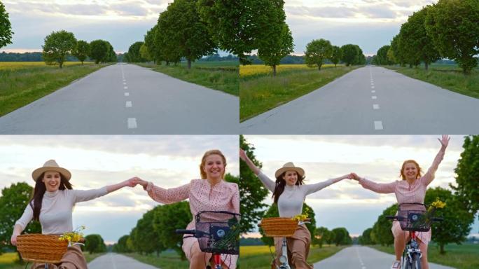慢动作开朗的女性朋友骑自行车时玩得开心