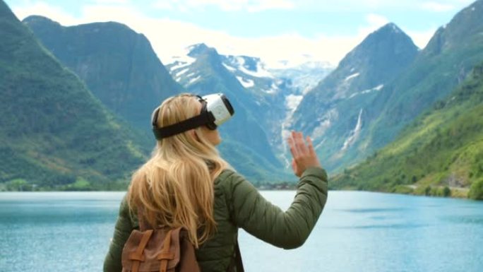 4k视频片段，一个无法识别的女人在探索Sogn og Fjordane时使用虚拟现实耳机